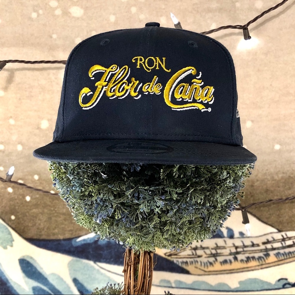 🌊 New Era Ron Flor de Caña Rum Blue Snapback OS